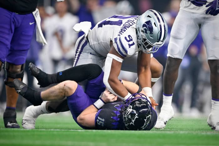 Dec 3, 2022; Arlington, TX, USA; Kansas State Wildcats defensive end Felix Anudike-Uzomah (91) sacks TCU Horned Frogs quarterback Max Duggan (15) during the second half at AT&T Stadium. Mandatory Credit: Jerome Miron-USA TODAY Sports